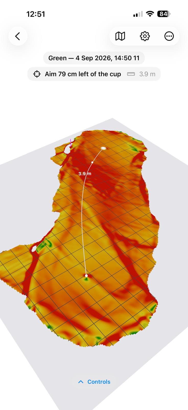 A scanned green drawn in 3D and coloured by slope, with the solved putt line curving 3.9 metres to the cup and the instruction “Aim 79 cm left of the cup”.